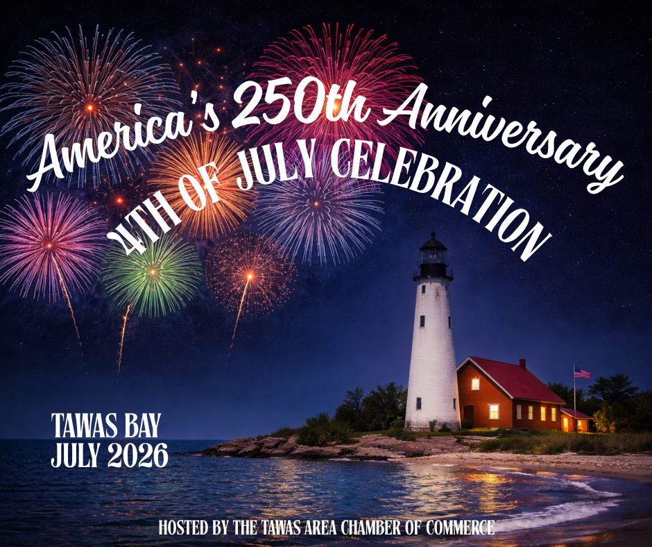 Tawas Bay lighthouse with fireworks over the water